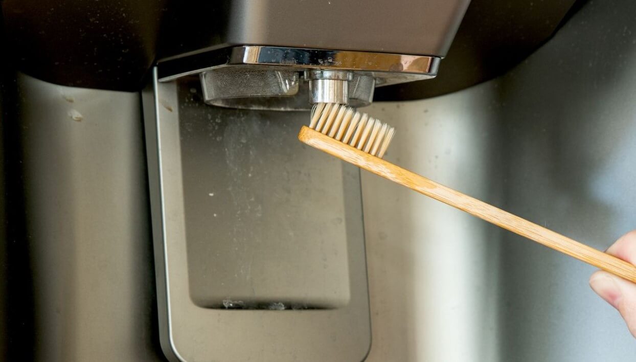 How To Clean Kenmore Elite Refrigerator Water Dispenser?