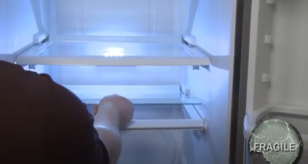 Reinstall the glass shelf in the whirlpool refrigerator