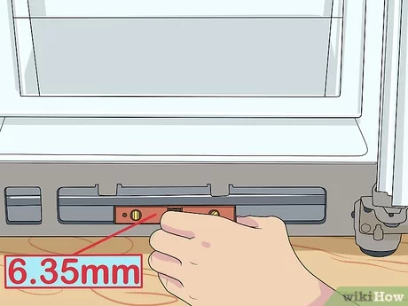 using a leveling tool to level your refrigerator