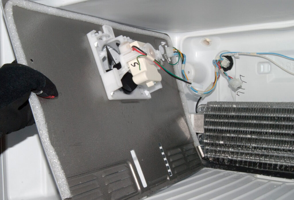 Where is the evaporator fan on a refrigerator